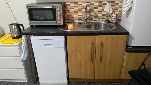 Een keuken of kitchenette bij bvapartments-Blackhouse