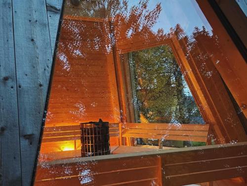 a view of a window in a wooden house at Hotell Åre Fjällsätra in Undersåker