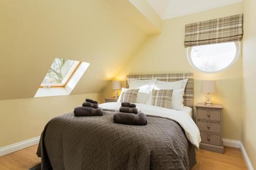 a bedroom with a bed with two teddy bears on it at Self contained accommodation near Delamere forest in Oakmere