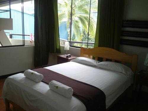 Ліжко або ліжка в номері Chanchamayo Inn Hotel