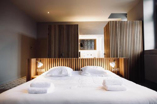 Postel nebo postele na pokoji v ubytování Domaine Sur Les Sarts
