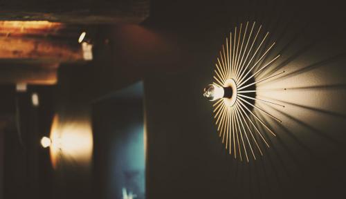 a fan is hanging on a wall at Domaine Sur Les Sarts in Ohey