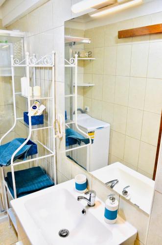 a bathroom with a sink and a mirror at Shanti, La Casa Azul in Palm-Mar