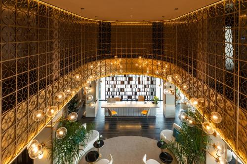 a living room with an archway with a couch at Hotel LIVVO Lumm in Las Palmas de Gran Canaria