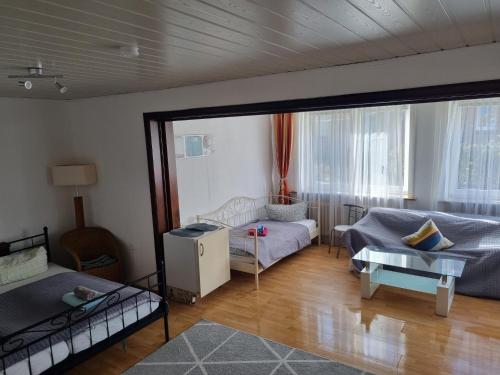 a living room with a couch and a table at Ferienunterkunft auf Sylt in Westerland (Sylt)