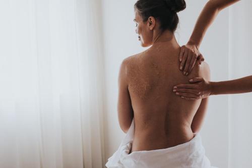a woman in a wedding dress holding her back at Hotel Tauernhof in Grossarl