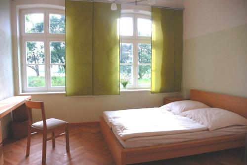 Ein Bett oder Betten in einem Zimmer der Unterkunft Flusshof Räbel