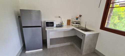 Kuchyň nebo kuchyňský kout v ubytování Samutra Residences