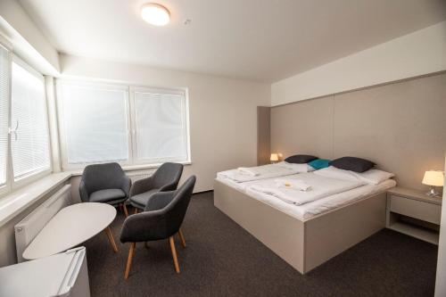 Postel nebo postele na pokoji v ubytování Hotel Rakovec