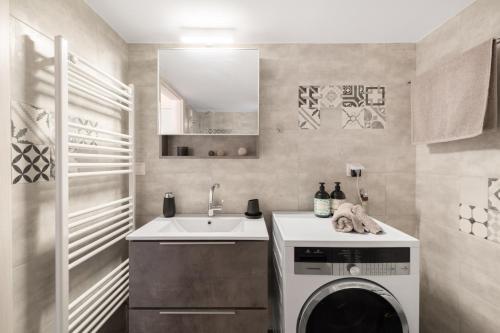 a kitchen with a washing machine and a sink at Katsanis luxury apt., stunning view of acropolis in Athens