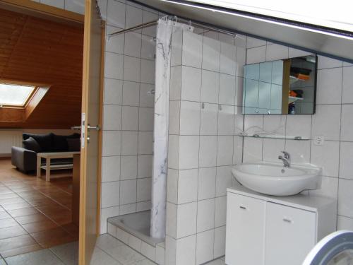 a bathroom with a sink and a mirror at Ipf Blick DG in Bopfingen
