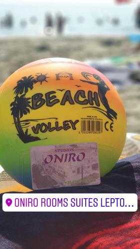 a yellow volleyball sitting on top of a towel at Oniro Rooms & Suites in Leptokaria