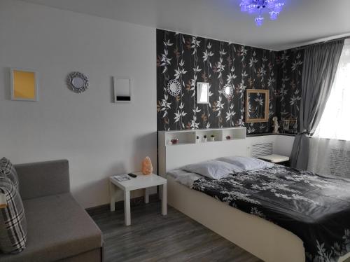 En eller flere senger på et rom på Apartamenty na Novgorodskoi