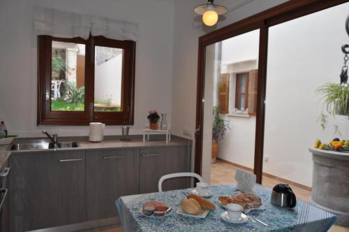 a kitchen with a table with a plate of food on it at Casa Amanada in Santa Margalida