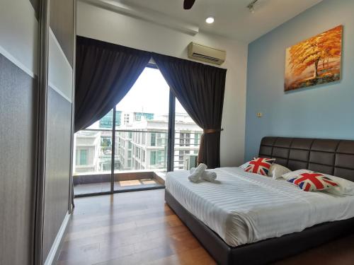 a bedroom with a bed and a large window at BC The Loft 2A Imago Studio in Kota Kinabalu