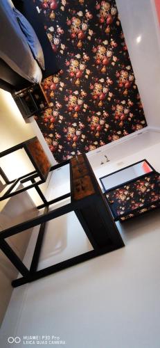 a painting of flowers on the ceiling of a room at La Pierre du Diable in Stavelot