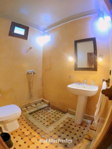 a bathroom with a sink and a toilet at Atlas Prestige in Imlil