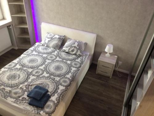 Кровать или кровати в номере Apartamenty Piotrkowska