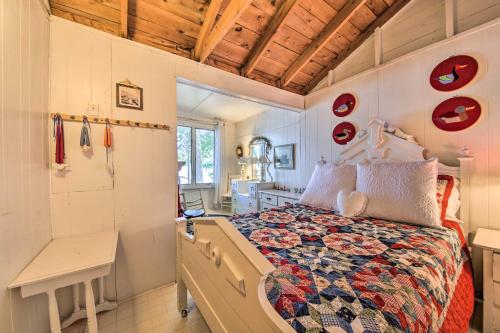 a small bedroom with a bed and a desk at Quiet and Lovely Lakefront Cottage for Families! in Union