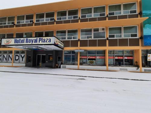 an empty parking lot in front of a building at Hotel Royal Plaza in Winnipeg
