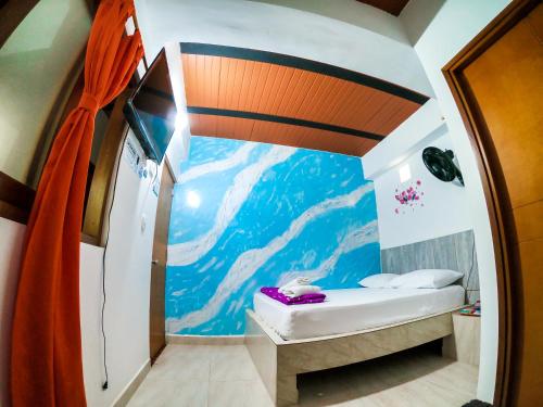 Piccola camera con murale di montagna. di Hotel Jireh - San Carlos Ant a San Carlos