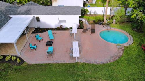 an overhead view of a patio with a swimming pool at Cheerfull 4/bed/ 3 Bath / pool / best Location in Naples