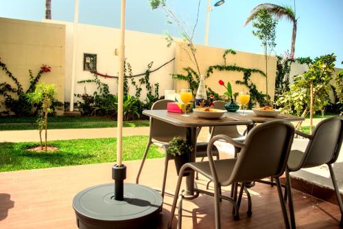 Κήπος έξω από το CASABAY Sidi Rahal, appartement avec accés direct à la plage et piscine