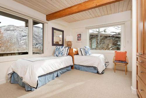 a bedroom with two beds and a window at Deluxe 3 Bedroom - Aspen Alps #508 in Aspen