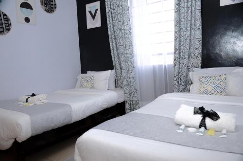 A bed or beds in a room at Hirwado Homes