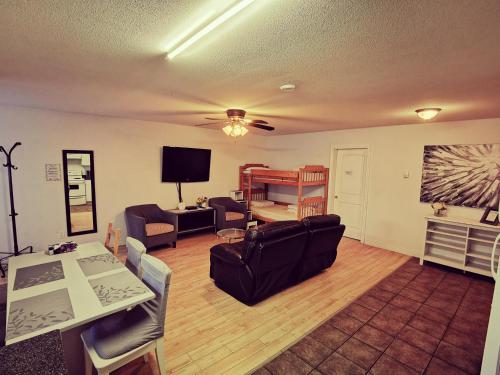 a living room with a couch and a bunk bed at Bear Creek Suite in Surrey