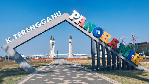 a sign that reads korean reform with two towers at Alexis KT Roomstay in Kuala Terengganu