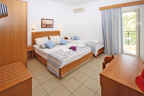 Posteľ alebo postele v izbe v ubytovaní Miramare Hotel