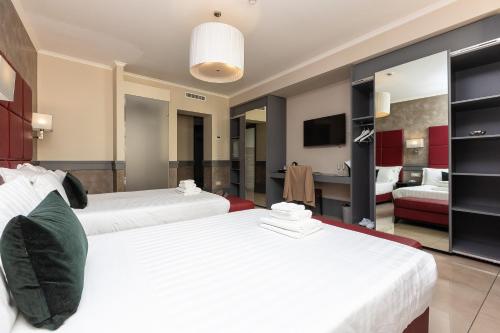 Un ou plusieurs lits dans un hébergement de l'établissement Hotel Castellino Roma