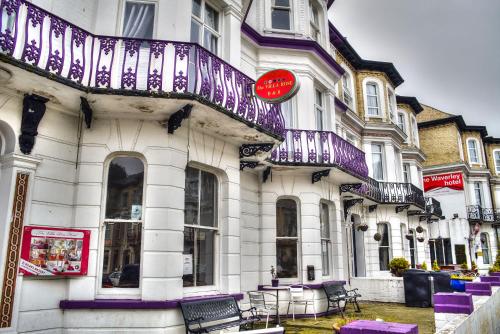 a building with a purple and white balcony on it at Villa Rose in Great Yarmouth