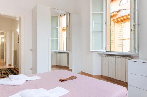 Posteľ alebo postele v izbe v ubytovaní Borgo Stretto Bright Apartments