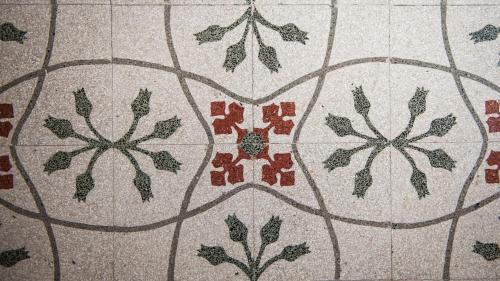 a tile floor with a flower pattern on it at Giardini Mon Plaisir in Trapani