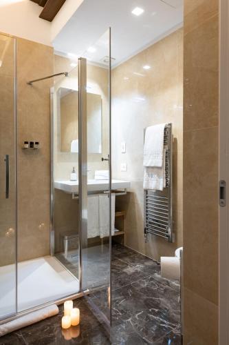 a bathroom with a shower and a sink at Kairos by Florence Art Apartments in Florence