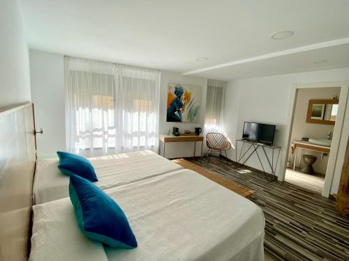 Posteľ alebo postele v izbe v ubytovaní Hotel Alamo