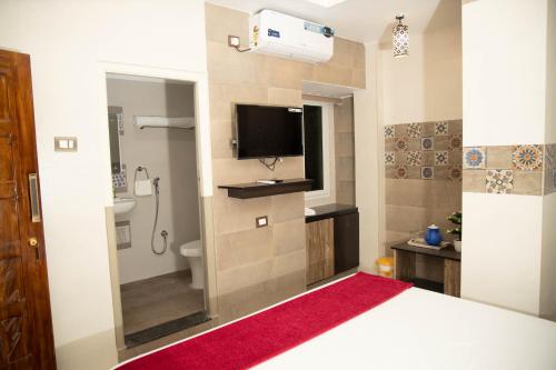 Postel nebo postele na pokoji v ubytování Hotel Ganesh Palace