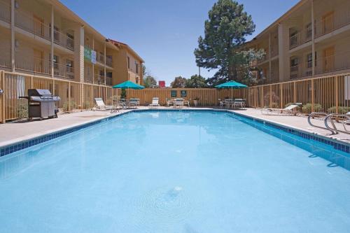 a large swimming pool in front of a hotel at La Quinta Inn by Wyndham Denver Golden in Golden