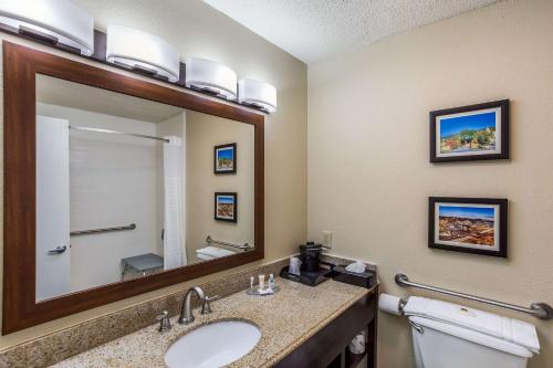 a bathroom with a sink and a mirror at Comfort Inn in Charleston
