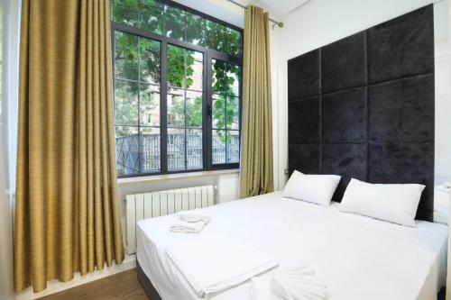 Postelja oz. postelje v sobi nastanitve Stay Inn-Apartments on Abovyan 32