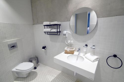 Ванна кімната в Concept Hotel by COAF