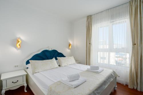 Säng eller sängar i ett rum på Luxury Sunset Residences - Okrug Gornji