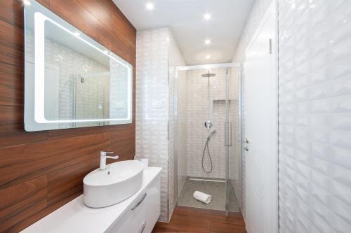 Ett badrum på Luxury Sunset Residences - Okrug Gornji