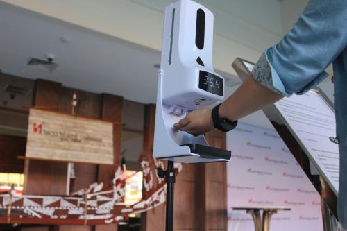 a person holding a nintendo wii game controller at Swiss-Belhotel Cendrawasih, Biak in Fandoi
