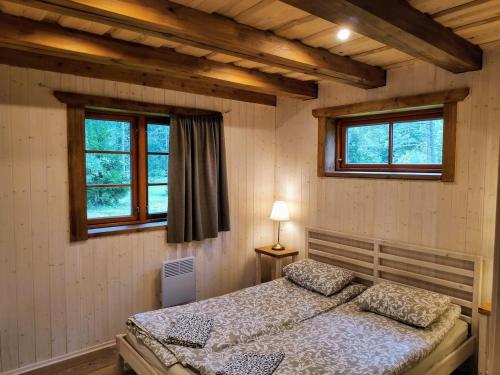 מיטה או מיטות בחדר ב-Jõeääre puhkekeskus