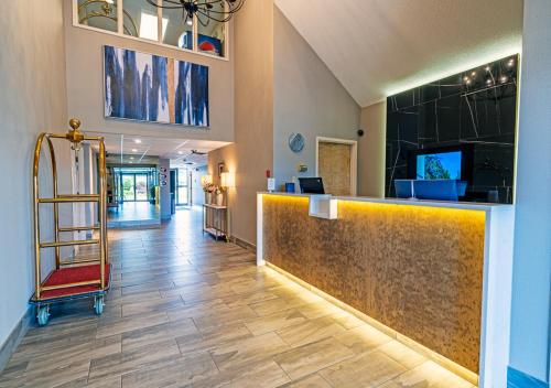 a lobby of a hospital with a reception counter at Slumber Inn in New Minas