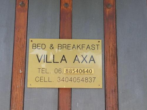 a sign that reads bed and breakfast villa akka at Villa Axa in Casal Palocco