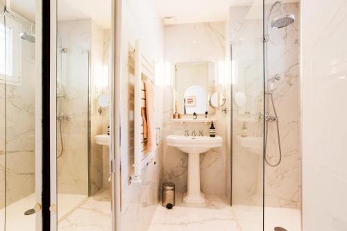 a bathroom with a sink and a shower at Terrace on the Bay 2 Villefranche-sur-Mer, AP4243 by Riviera Holiday Homes in Villefranche-sur-Mer